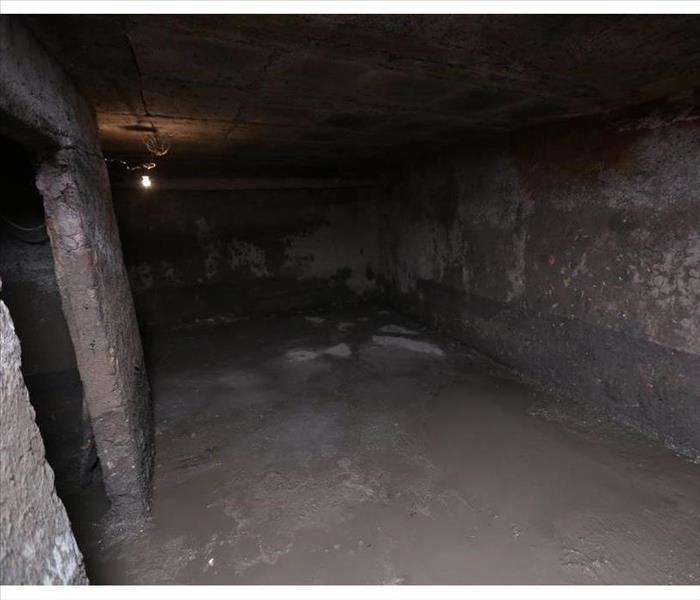 the old dirty cellar flooded from a pipe break, an abandoned
